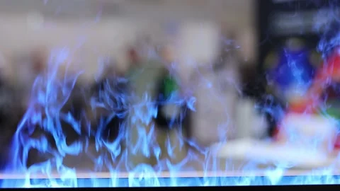 Close-up of an electric fireplace with a green flame. Stock Footage 240642439