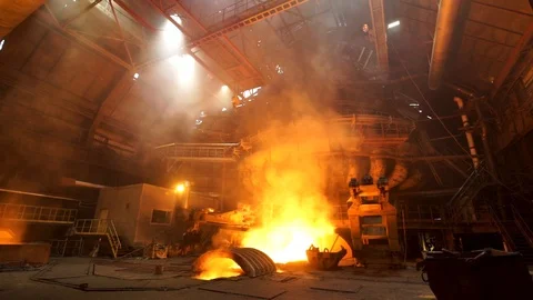 Close up for the electric furnace with melting metal and rising smoke. Stock Stock Footage 113455634