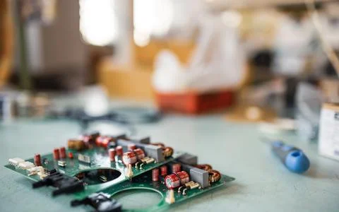 Close-up electric green embedded microcircuits in production 写真素材