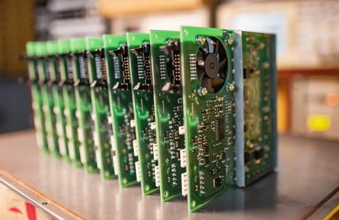 Close-up electric green embedded microcircuits in production Stock-Fotos