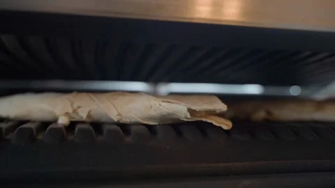 Close-up of an electric grill with pita bread on it, close-up Stock Footage 313578205