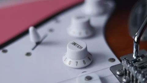 Close-up of electric guitar controls and bridge with shallow depth of field Stock Footage 339191222