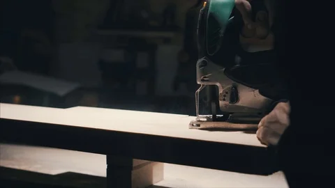 Close-up electric jigsaw cutting a piece of wood, a thick piece of wood , lowlig 스톡 동영상 78438166