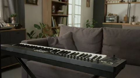 Close Up of Electric Keyboard in Studio Apartment Interior Stock Footage 333417109