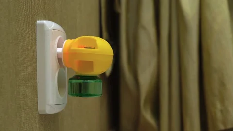 Close-Up of Electric Liquid Mosquito Repeller Into Electic Outlet on a Wall 스톡 동영상 127846933