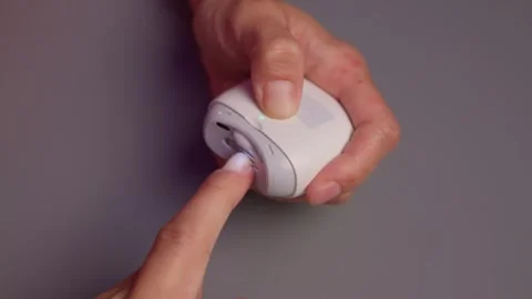 Close-up of an electric nail clipper in hand, modern personal care technology Stock Footage 312902731
