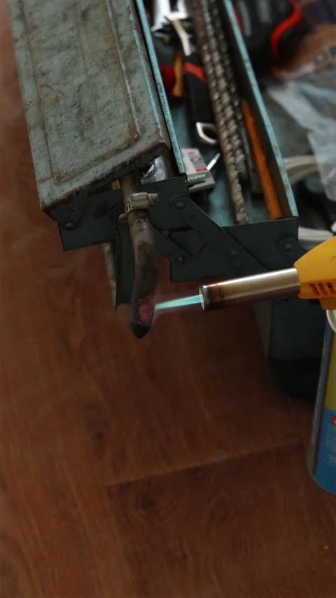 Close up of electric soldering tool heating on stand vertical Stock Footage 339298241
