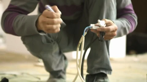 Close up electric technician fixing cables Stock Footage 128928907