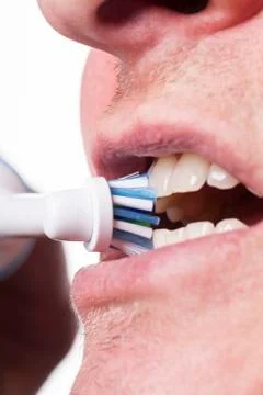 Close up of electric toothbrush and paste on white Stock Photos