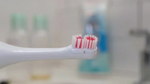 Close up of a electric toothbrush Stock Footage 330373222