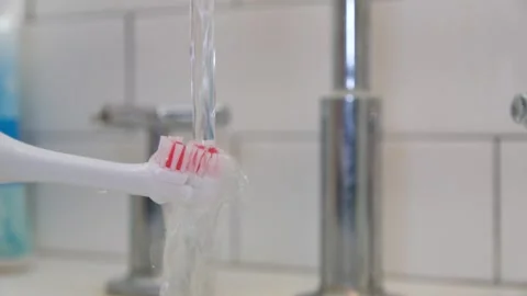 Close up of a electric toothbrush Stock Footage 330373231
