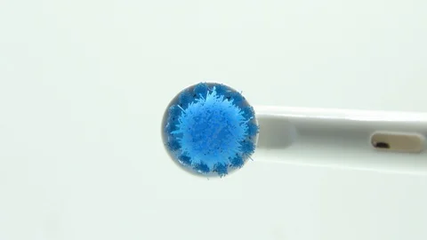 Close-up of an electric toothbrush on a white background. 4K Stock Footage 128832709