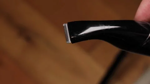 Close up of electric trimmer head with moving blades, black grooming device.. Stock Footage 319825612