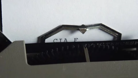 Close-Up of Electric Typewriter Typing 'CIA FBI' 스톡 동영상 277231392