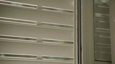 Close up of electric window blinds open to reveal garden Video stock 126423579