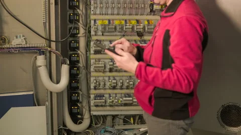 Close up of electrical engineer using digital tablet for diagnostics Stock Footage 328607839