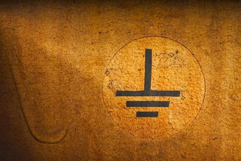 Close up of an electrical grounding symbol on an train wagon Foto stock