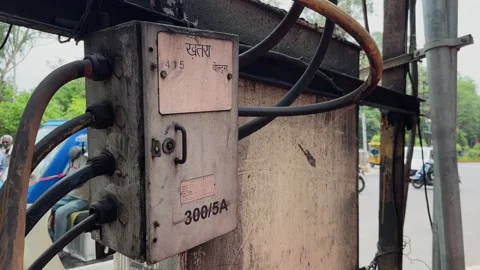 Close up of an electrical junction box with wiring mounted on a roadside Stock Footage 340975089
