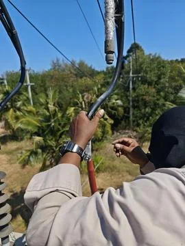Close up of electrical lineman hands preparing copper shield wires of high .. Stock Photos