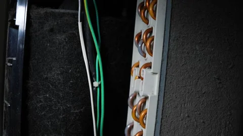 Close-up of an electrical panel interior with copper connectors and green a.. Stock Footage 338319364