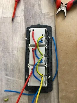 Close Up of Electrical Switch Assembly with Tools and Wires Stock Photos