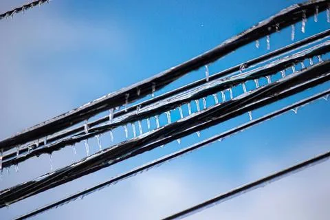 Close-up of electrical wires with blue sky background Stock Photos