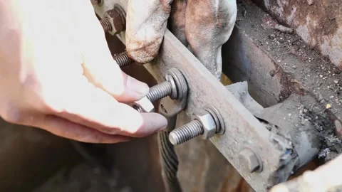 Close-Up of Electrician Using Wrench to Disconnect Grounding Wire 動画素材 297919387