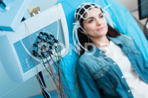 Close up of electroencephalograph recording brain waves of woman Stock Photos