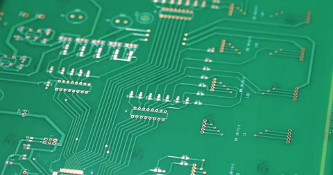 Close-up of electronic board moving on a conveyor belt. Manufacturing of Stock Footage 201210380