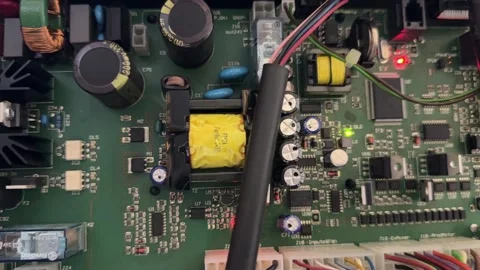 Close up of electronic circuit board inside appliance, internal control system Stock Footage 337116914