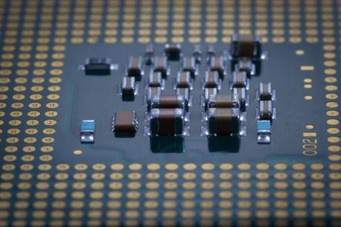 Close-Up of Electronic Circuit Components on a Microchip Surface Stock Photos