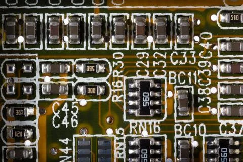 Close-Up of Electronic Components on a Circuit Board with Detailed Layout Stock Photos