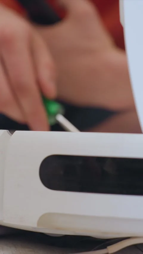 Close up of electronic device repair with screwdrivers and tools on component Stock Footage 348037596