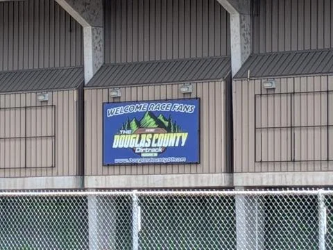 Close-up of electronic Douglas County Dirt Track sign welcoming race fans Stock Photos