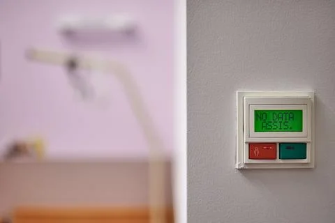 Close up of an electronic nurse call system and emergency button on a wall in Fotos Stock