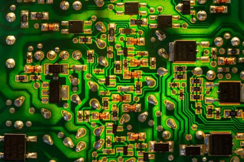 Close-up of an electronic printed green computer circuit board. Back lit. Stock Photos