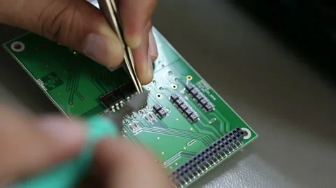 Close up of electronics engineer checking a circuit board. Microchip Inventor Stock Footage 46113897
