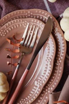 Close-up of elegant autumn table setting with pumpkins and vintage cutlery Stock Photos