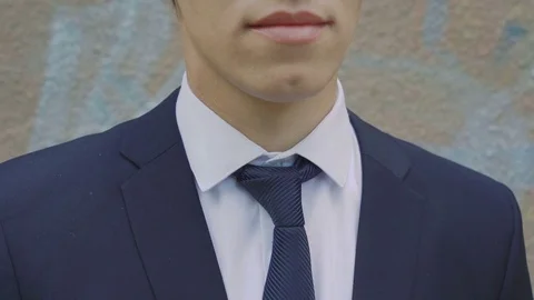 Close up of elegant business man in white shirt correcting his tie 4K Stock Footage
