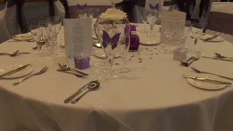 Close up of elegant, decorated table prepared for a luxury wedding dinner sequen Video stock 122161301