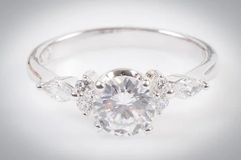 Close up of elegant diamond ring on the white background. Diamond ring. Stock Photos