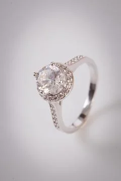 Close up of elegant diamond ring on the white background. Diamond ring. Stock Photos