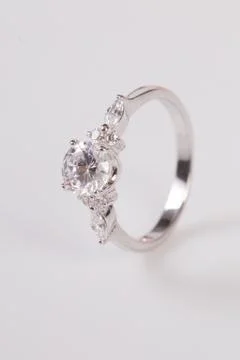 Close up of elegant diamond ring on the white background. Diamond ring. Stock Photos