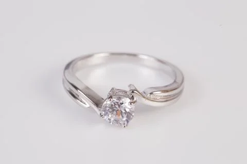 Close up of elegant diamond ring on the white background. Diamond ring. Stock Photos
