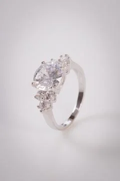 Close up of elegant diamond ring on the white background. Diamond ring. Stock Photos
