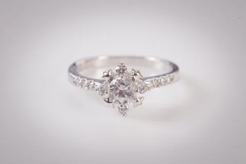 Close up of elegant diamond ring on the white background. Diamond ring. Stock Photos