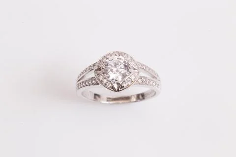 Close up of elegant diamond ring on the white background. Diamond ring. Stock Photos