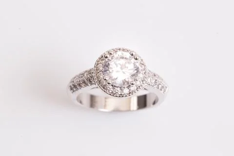 Close up of elegant diamond ring on the white background. Diamond ring. Stock Photos