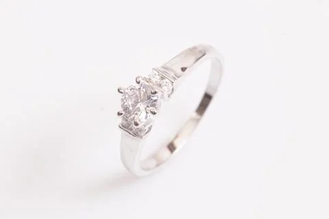Close up of elegant diamond ring on the white background. Diamond ring. Stock Photos
