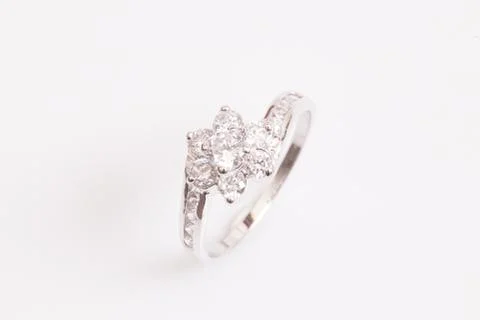 Close up of elegant diamond ring on the white background. Diamond ring. Stock Photos